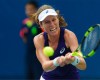 Johanna Konta trying to hit a tennis ball