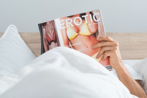 Man reading a porn mag